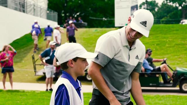 Joaquin Niemann with caddie from The First Tee at Charles Schwab Challenge
